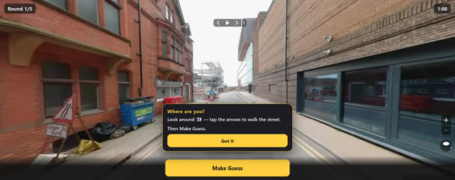 A street-level panorama with a round timer and navigation arrows